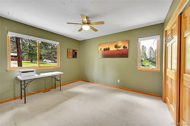 28065 Camel Heights Cir, Evergreen, CO 80439 - unfurnished room featuring plenty of natural light, baseboards, light carpet, and ceiling fan