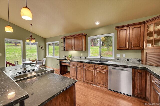 28065 Camel Heights Cir, Evergreen, CO 80439 - kitchen featuring dishwasher, a sink, light wood-type flooring, hanging light fixtures, and vaulted ceiling