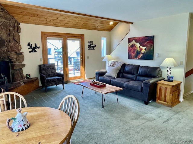 carpeted living room with lofted ceiling, a fireplace, wooden ceiling, and french doors