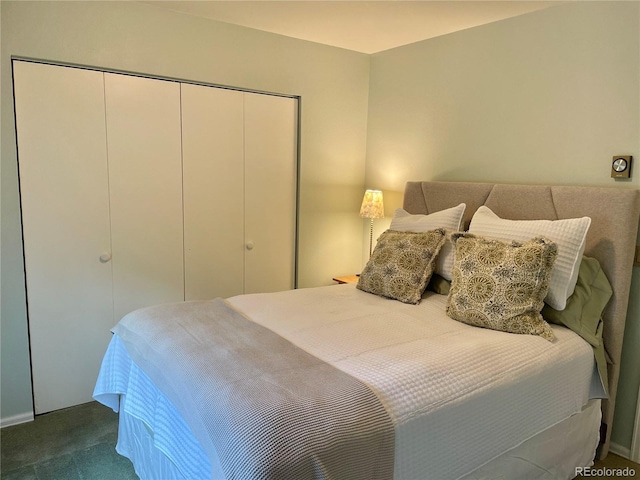 carpeted bedroom with a closet