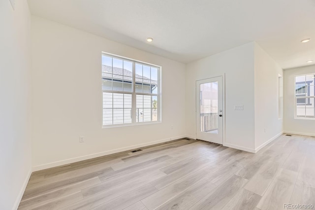 unfurnished room with light hardwood / wood-style flooring