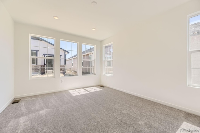 empty room with carpet flooring