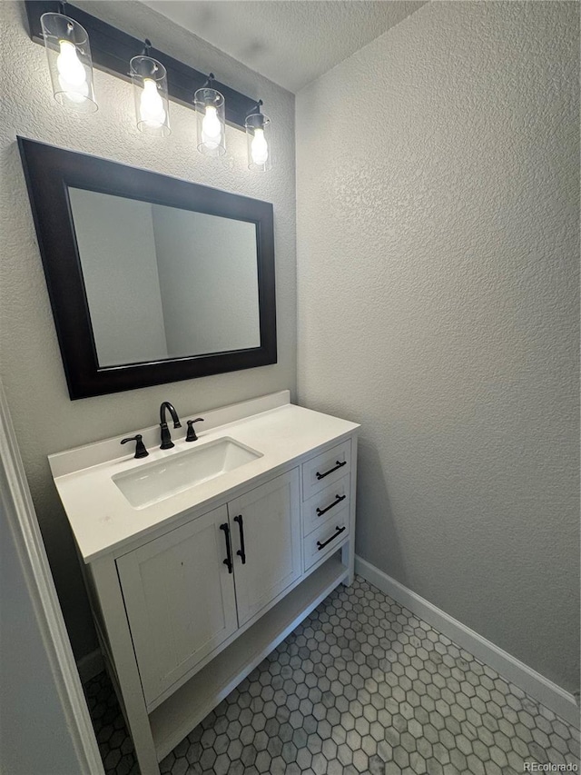 1285 Colorado Blvd Unit 3, Denver, CO 80206 - bathroom with vanity and a textured wall