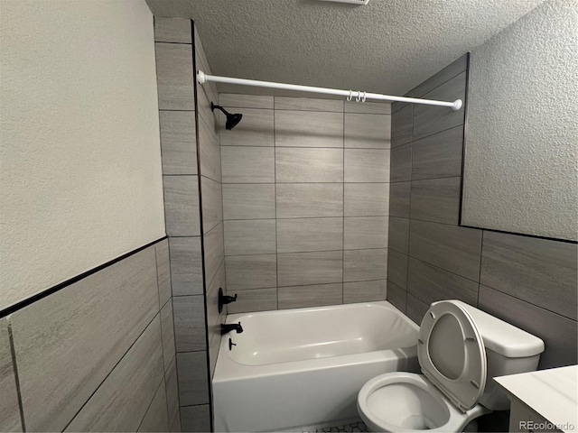 1285 Colorado Blvd Unit 3, Denver, CO 80206 - full bath featuring  shower combination, vanity, tile walls, a textured ceiling, and a textured wall