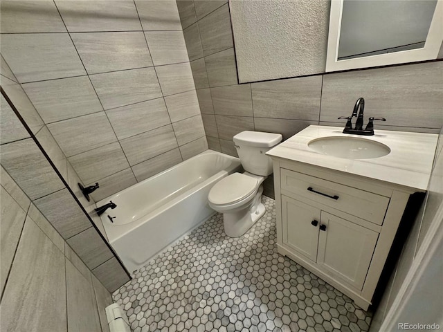 1285 Colorado Blvd Unit 3, Denver, CO 80206 - bathroom featuring vanity, bathing tub / shower combination, and tile walls
