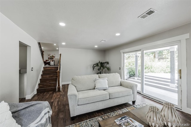 living room featuring dark wood-type flooring