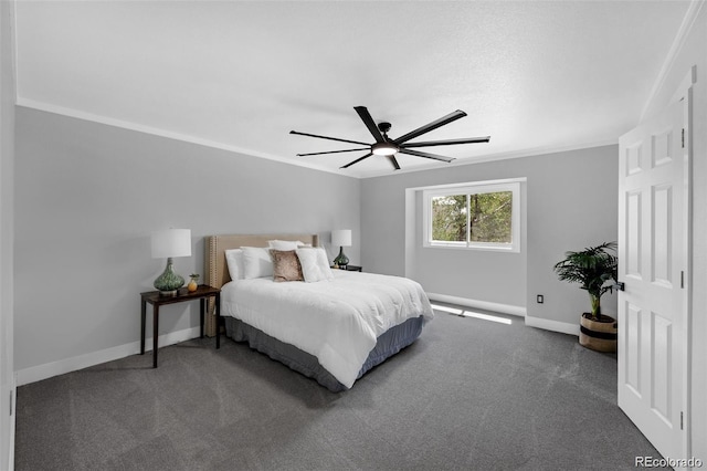 bedroom with ceiling fan, dark colored carpet, and ornamental molding