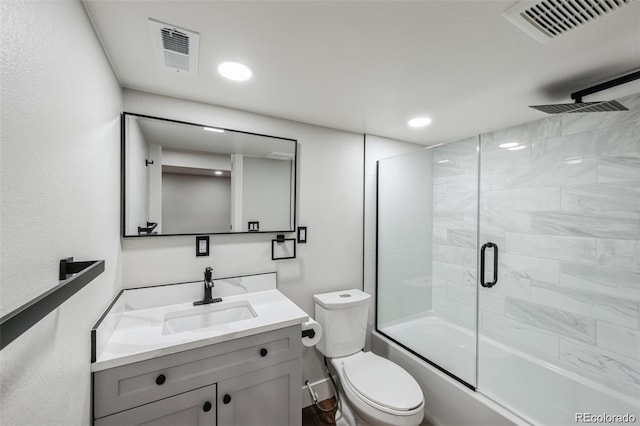 full bathroom with vanity, toilet, and enclosed tub / shower combo