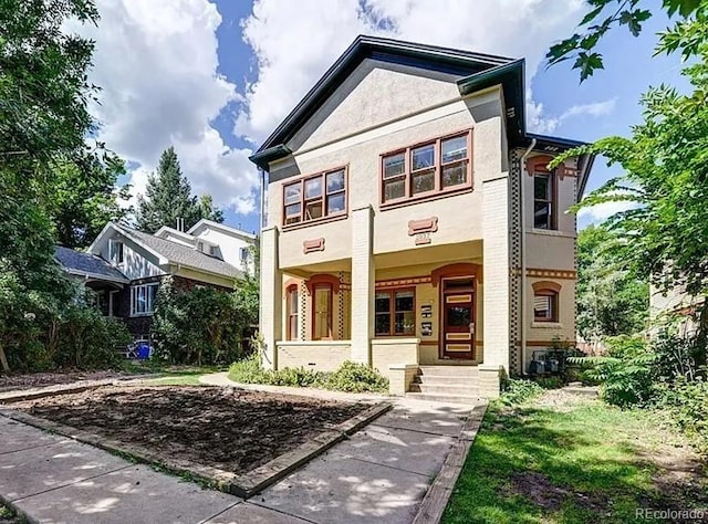 1037 12th St, Boulder, CO 80204 - view of front of house with a porch and stucco siding