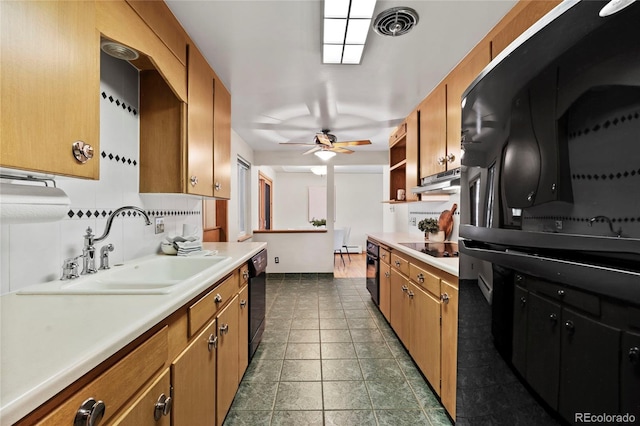 kitchen featuring tasteful backsplash, sink, ceiling fan, and black appliances