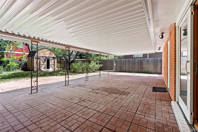 view of patio with a storage shed