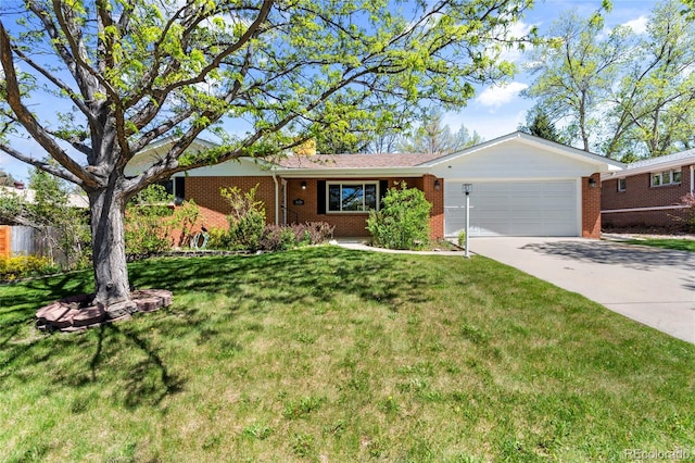 ranch-style home featuring a garage and a front lawn