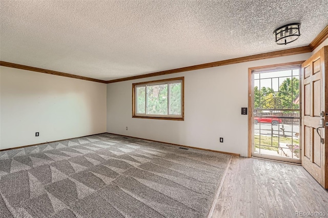 1824 S Granby St, Aurora, CO 80012 - carpeted spare room featuring crown molding, a textured ceiling, and baseboards