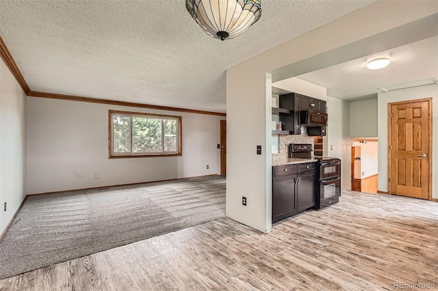 1824 S Granby St, Aurora, CO 80012 - kitchen featuring black appliances, light wood finished floors, ornamental molding, baseboards, and light countertops