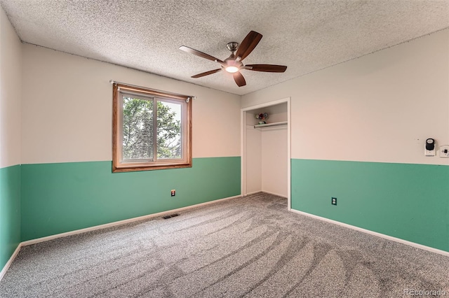 1824 S Granby St, Aurora, CO 80012 - unfurnished bedroom with carpet floors, a closet, a textured ceiling, a ceiling fan, and baseboards