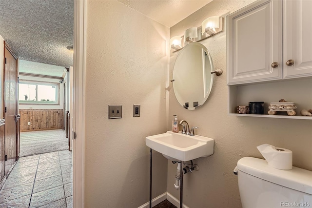 1824 S Granby St, Aurora, CO 80012 - half bathroom featuring toilet and a textured ceiling