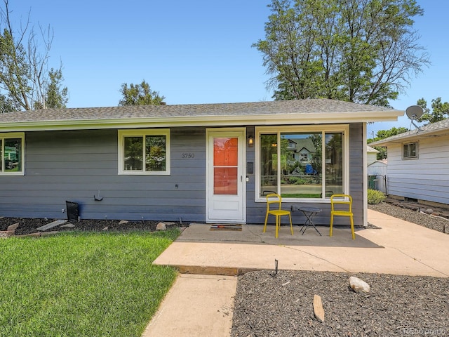 3750 S Galapago St, Englewood, CO 80110 - view of front of property with a front lawn and a shingled roof