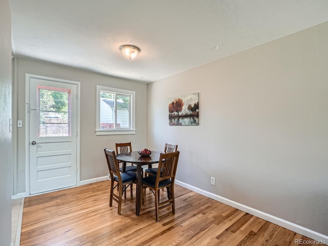3750 S Galapago St, Englewood, CO 80110 - dining space featuring light wood-style flooring and a textured ceiling
