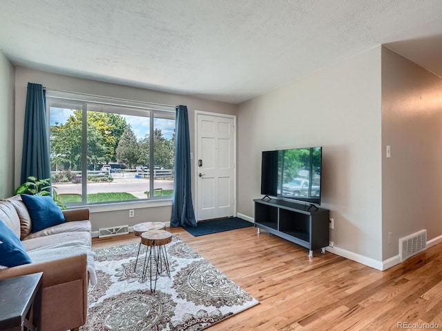 3750 S Galapago St, Englewood, CO 80110 - living room with wood finished floors and a textured ceiling