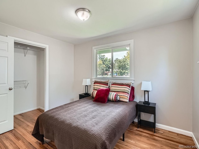 3750 S Galapago St, Englewood, CO 80110 - bedroom featuring light wood-style flooring and a closet
