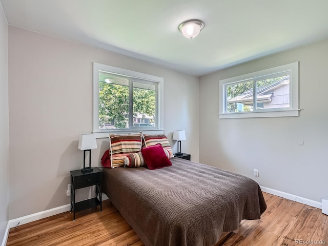 3750 S Galapago St, Englewood, CO 80110 - bedroom featuring wood finished floors and baseboards