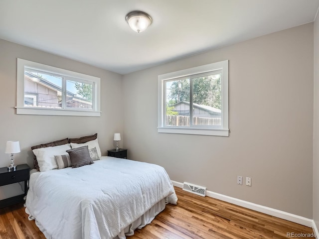 3750 S Galapago St, Englewood, CO 80110 - bedroom featuring baseboards and wood finished floors