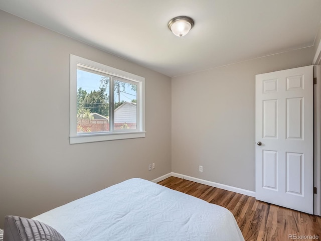 3750 S Galapago St, Englewood, CO 80110 - bedroom featuring baseboards and wood finished floors