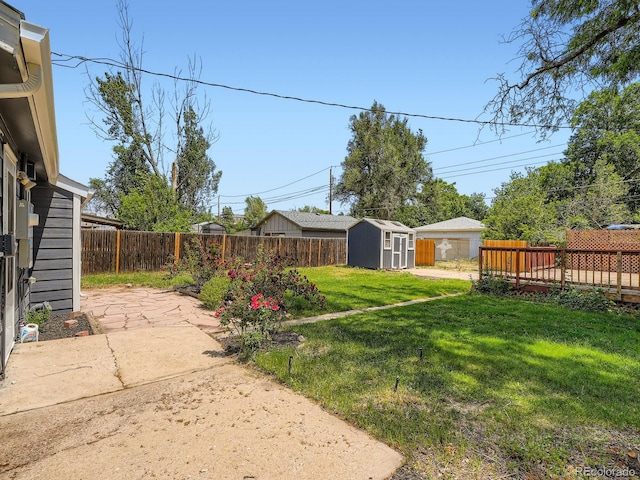 3750 S Galapago St, Englewood, CO 80110 - fenced backyard featuring a storage shed and a patio