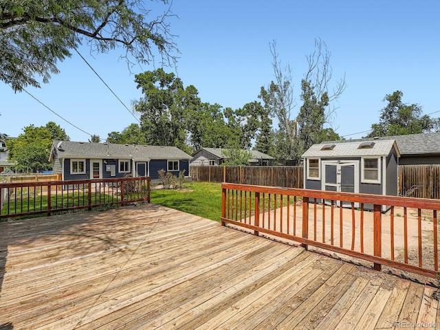 3750 S Galapago St, Englewood, CO 80110 - wooden terrace featuring a fenced backyard and a storage unit