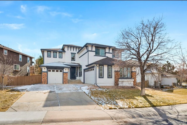 view of front facade with a garage and a front lawn