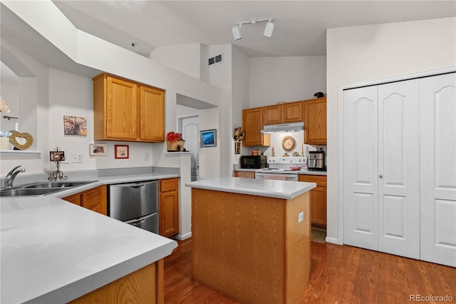 kitchen with white electric stove, dishwasher, a center island, light countertops, and a sink