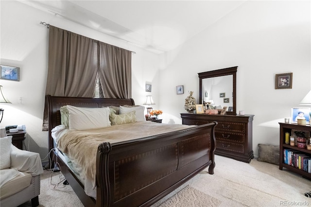 bedroom with light colored carpet