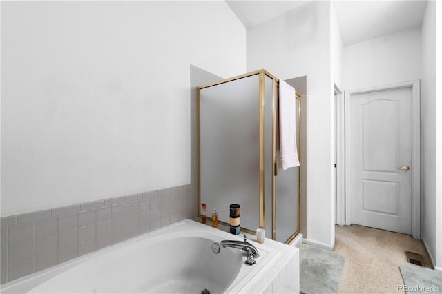 bathroom with a garden tub and a shower stall