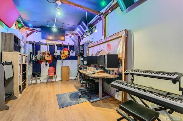 office area featuring wood-type flooring and a wall mounted AC