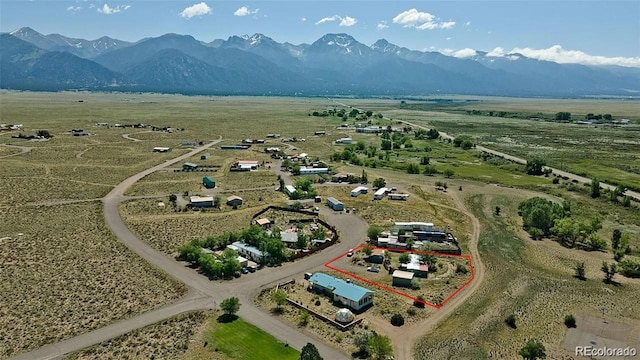 drone / aerial view with a mountain view and a rural view