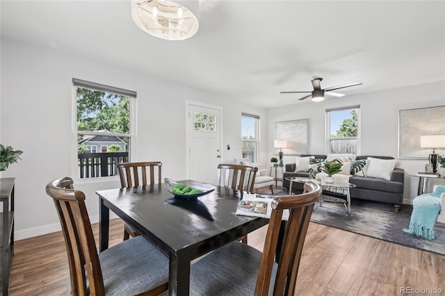 112 S Hooker St, Denver, CO 80219 - dining space with a ceiling fan and light wood finished floors