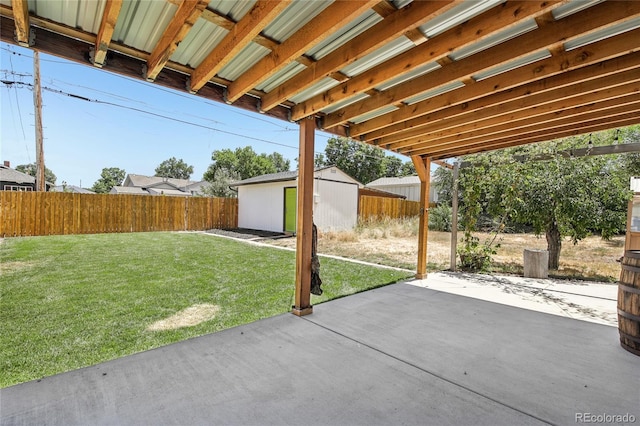 112 S Hooker St, Denver, CO 80219 - fenced backyard with a patio area and a storage unit