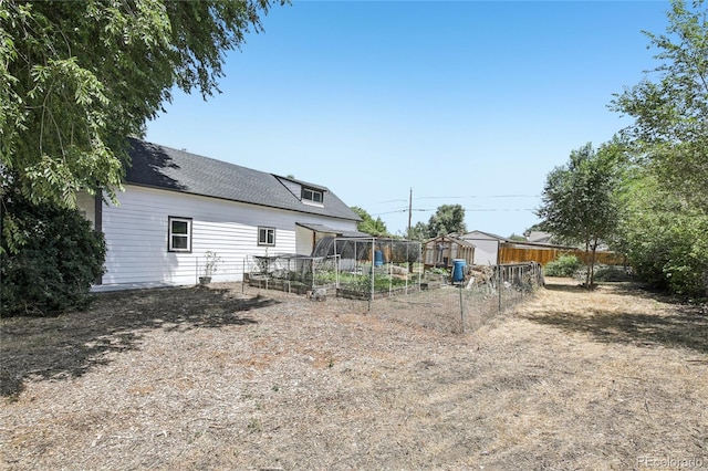 112 S Hooker St, Denver, CO 80219 - view of yard featuring a garden and a storage shed