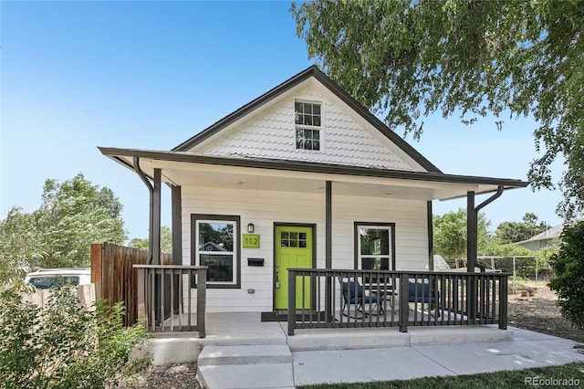 112 S Hooker St, Denver, CO 80219 - shotgun-style home featuring covered porch