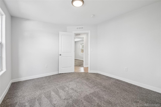 112 S Hooker St, Denver, CO 80219 - carpeted empty room featuring baseboards