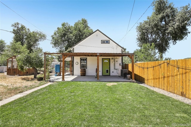 112 S Hooker St, Denver, CO 80219 - back of property with a fenced backyard and a patio