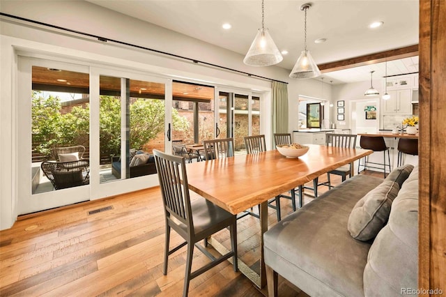 700 Cheyenne St, Golden, CO 80401 - dining space featuring recessed lighting, beamed ceiling, visible vents, and light wood-style floors