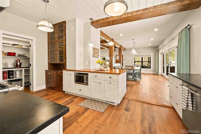 700 Cheyenne St, Golden, CO 80401 - kitchen featuring stainless steel appliances, wood counters, white cabinetry, and light wood-style floors