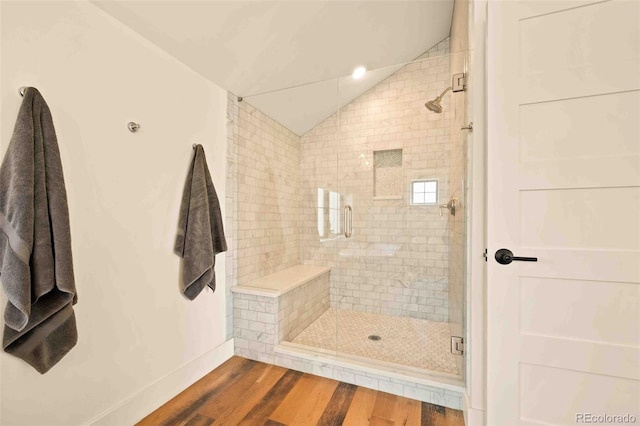 700 Cheyenne St, Golden, CO 80401 - bathroom with baseboards, wood finished floors, vaulted ceiling, and a shower stall