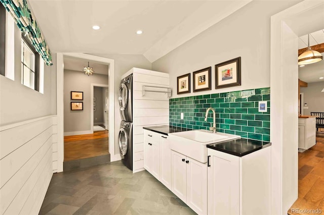 700 Cheyenne St, Golden, CO 80401 - laundry area with a sink, stacked washer and clothes dryer, recessed lighting, and laundry area