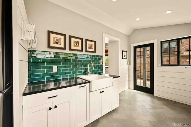 700 Cheyenne St, Golden, CO 80401 - kitchen featuring white cabinets, dark countertops, a sink, recessed lighting, and vaulted ceiling