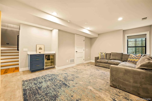 700 Cheyenne St, Golden, CO 80401 - living room featuring stairs, baseboards, light tile patterned floors, wine cooler, and visible vents