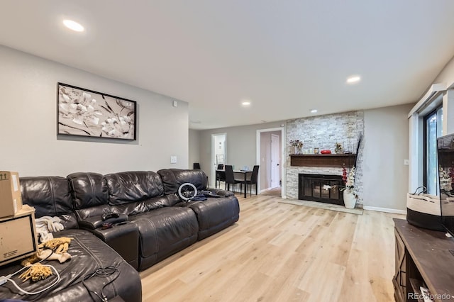 15047 E Louisiana Dr Unit A, Aurora, CO 80012 - living area with light wood-type flooring, a fireplace, and recessed lighting