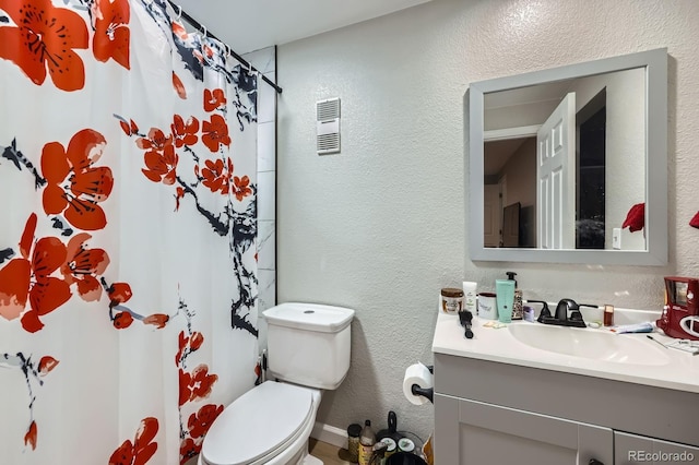 15047 E Louisiana Dr Unit A, Aurora, CO 80012 - bathroom with a textured wall, vanity, and a shower with shower curtain