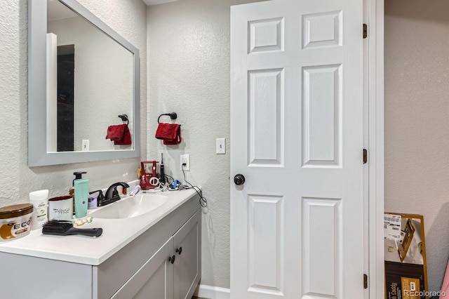 15047 E Louisiana Dr Unit A, Aurora, CO 80012 - bathroom with a textured wall and vanity